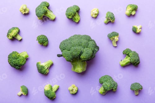 Preview: green fresh broccoli background close up on colored table. Vegetables for diet