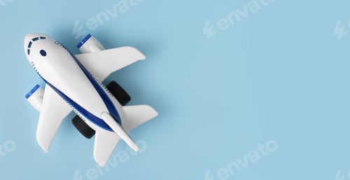 Preview: Aviation concept. Toy airplane on a blue background. Concept of tourism. Copy space
