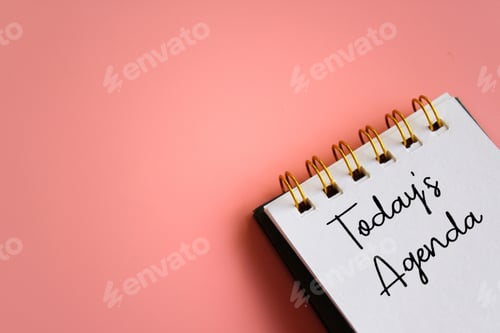 Preview: Notebook with text TODAY'S AGENDA on pink background