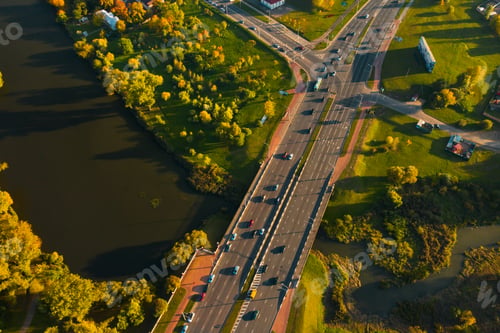Preview: View from the height of the road with cars near the autumn Park