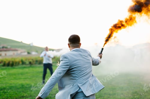 Preview: Man carrying a smoke bomb and running