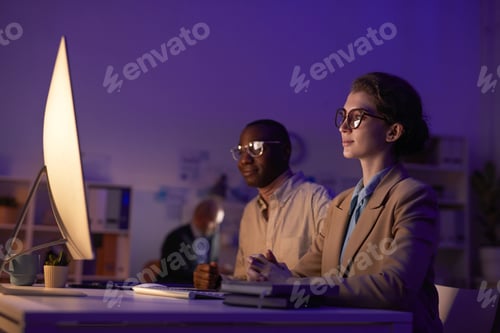 Preview: People Working Late In Office