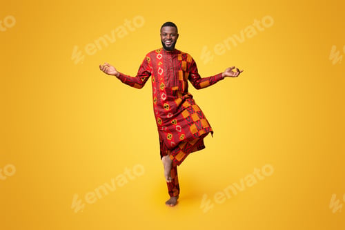Preview: Happy african man standing on one leg, meditating