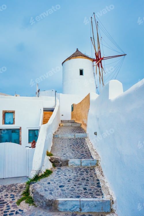 Preview: Old greek windmill on Santorini island in Oia town with stairs in street. Santorini, Greece