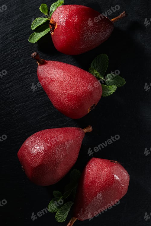 Preview: Tasty and delicious food concept - pear in wine