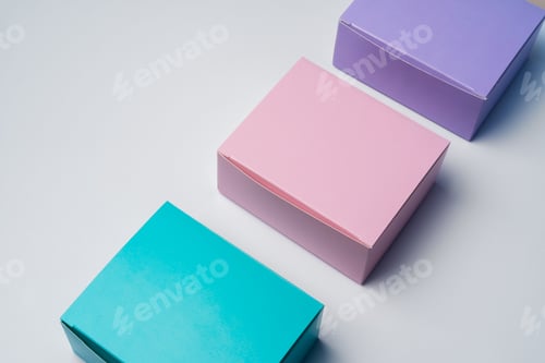 Preview: Pile of colorful cardboard boxes on white background