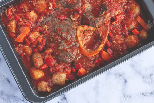 Preview: ossobuco stew with vegetables, knuckle on the bone with new potatoes, in tomato sauce,homemade,