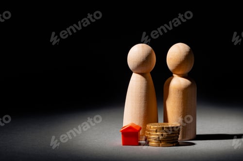 Preview: Wooden family with toy house and stack of coins. Savings for house purchase concept