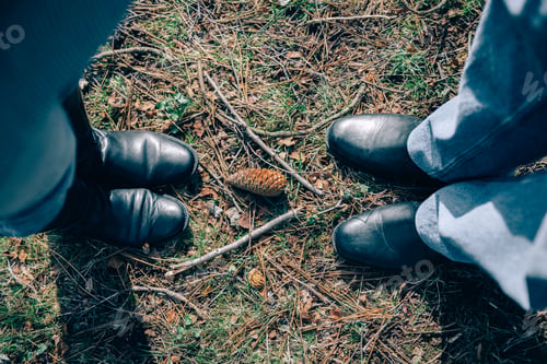 Preview: Top view of senior couple legs over grass