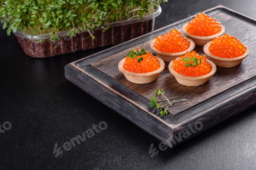 Preview: Delicious fresh red caviar on a dark concrete table