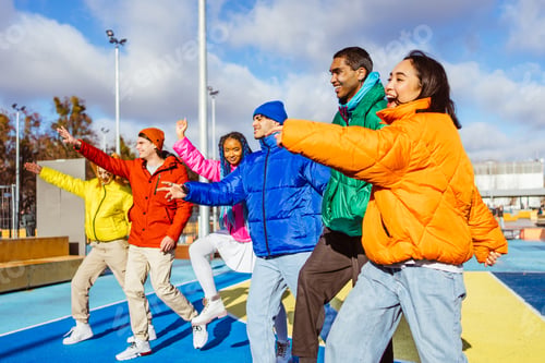 Preview: Multiracial group of young friends meeting outdoors in winter