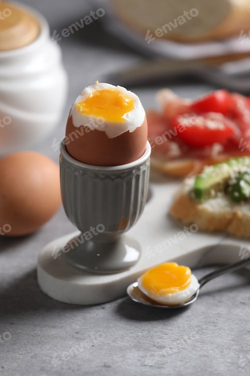 Preview: Tasty boiled chicken egg served for breakfast on light grey table
