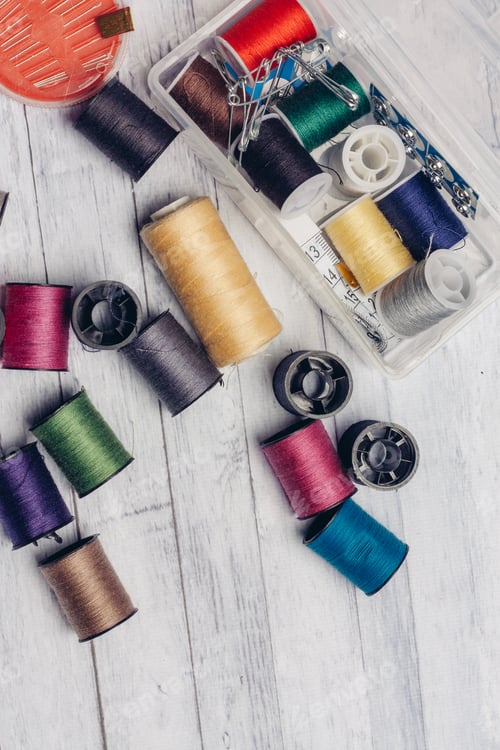 Preview: thread needles pins wooden background sewing accessories Copy Space