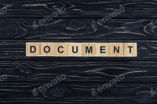 Preview: top view of word document made of wooden blocks on dark wooden tabletop