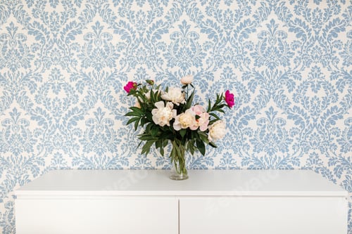 Preview: Peonies Fresh Cut Flowers in vase with copy space on white table on blue background