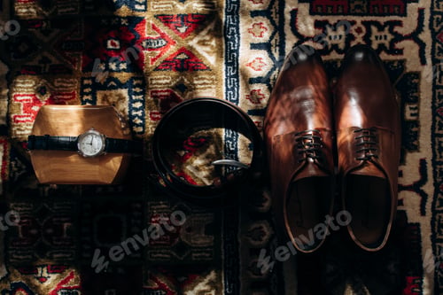 Preview: stylish watch shoes and belt top view in sunlight
