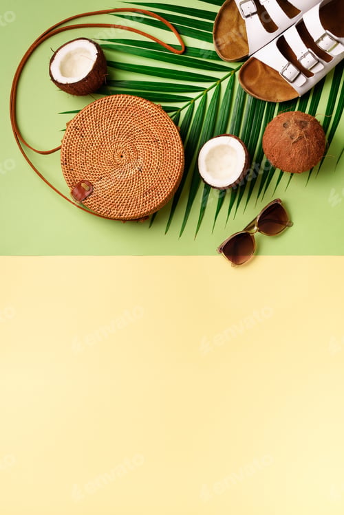 Preview: Round rattan bag, coconut, birkenstocks, palm branches, sunglasses on green background. Banner. Top