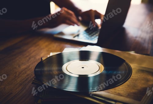 Preview: Vinyl record and a collection of albums