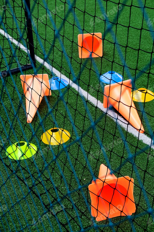 Preview: Soccer goal and cones on green artificial turf