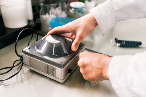 Preview: Closeup Faceless Scientist Working in Lab