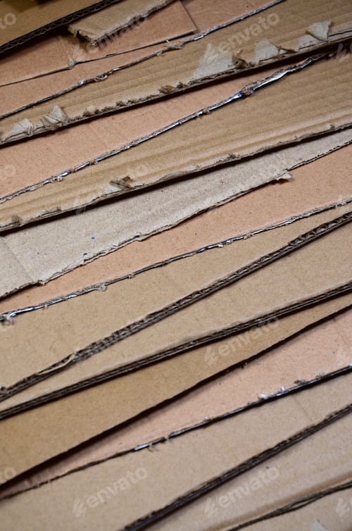 Preview: Background image with a lot of beige cardboard paper, which is used to make boxes