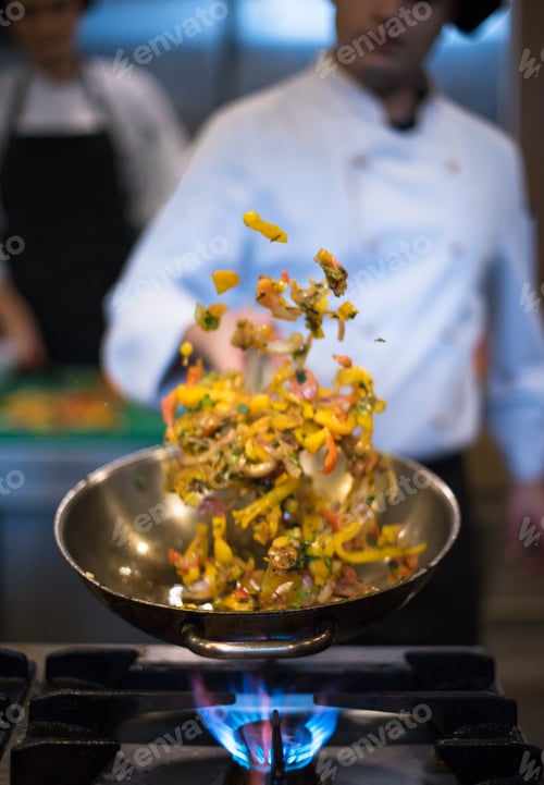 Preview: chef flipping vegetables in wok