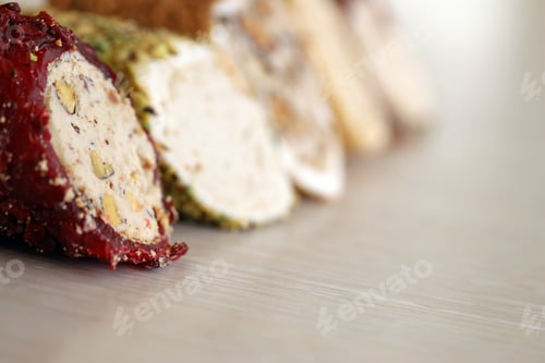 Preview: Rolls of turkish delight with many different flavors and fillings close up on table
