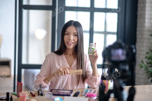 Preview: Beauty blogger brushing her hair and telling about vitamins