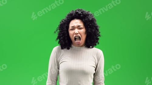 Preview: Young black female with a curly afro and a disgusted expression on a green screen background