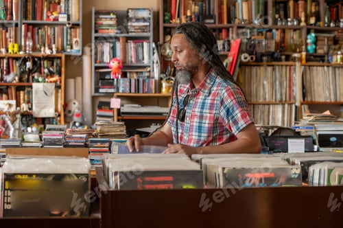 Preview: Man browsing through vinyl records