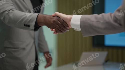 Preview: Business people shacking hands together showing successful contract agreement
