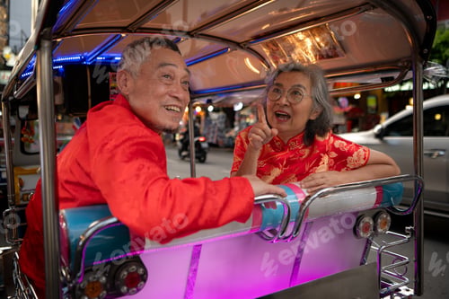 Preview: A happy senior couple in a Chinatown in Bangkok, Thailand,
