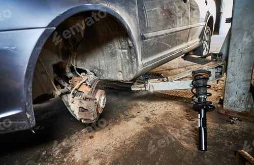 Preview: Repairman, worker changing car wheel.