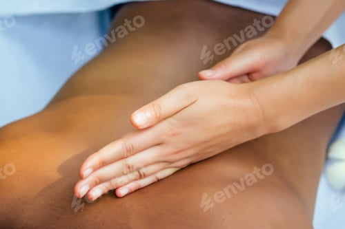Preview: brazilian woman getting back and shoulders massaging in outdoor spa Ayurveda