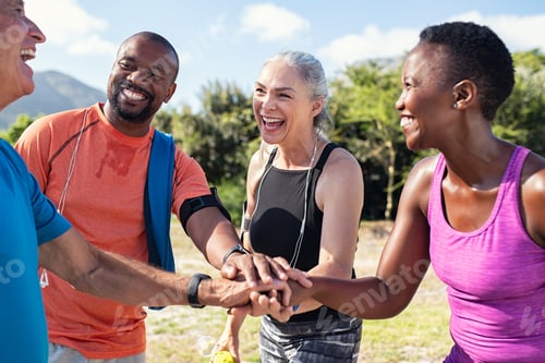 Preview: Mature people stacking hands after workout