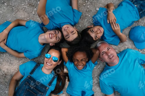 Preview: Group of people happy lying on the ground