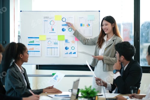 Preview: Female Operations Manager Holds Meeting Presentation for a Team of Economists. Asian Woman Uses Digi