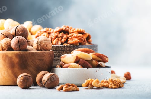 Preview: Cashews, hazelnuts, walnuts, pecans, almonds and other. Healthy food snack mix on gray table