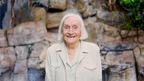 Preview: Great grandmother smiling at camera in a nursing home