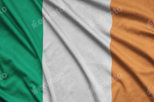 Preview: Ireland flag is depicted on a sports cloth fabric with many folds. Sport team waving banner