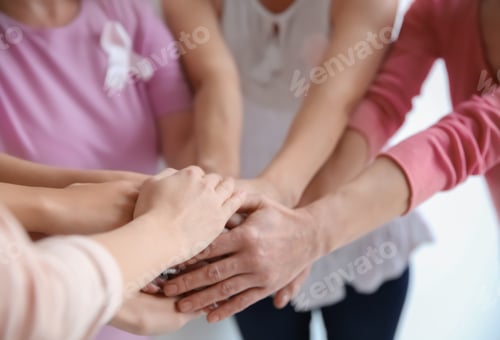 Preview: Group of women with silk ribbons joining hands, closeup. Breast cancer awareness concept