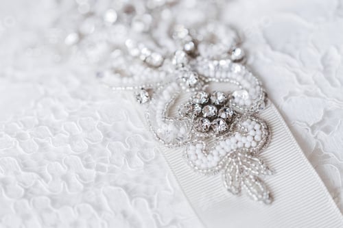 Preview: Beautiful details of a wedding dress beadwork close-up