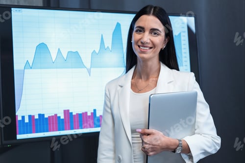 Preview: Portrait of young business woman on statistics graphs background.