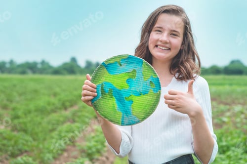 Preview: girl holding drawn planet in hands