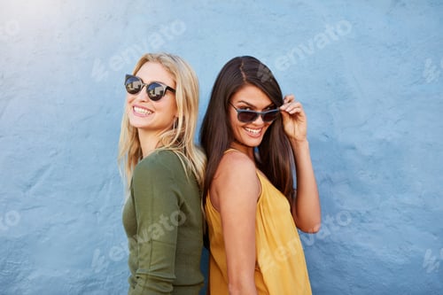 Preview: Happy young female friends standing together