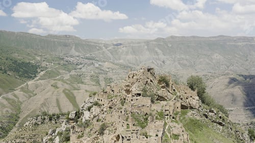 Preview: Ruins of ancient village with abandoned building stone walls on a mountain slope. Action. Summer