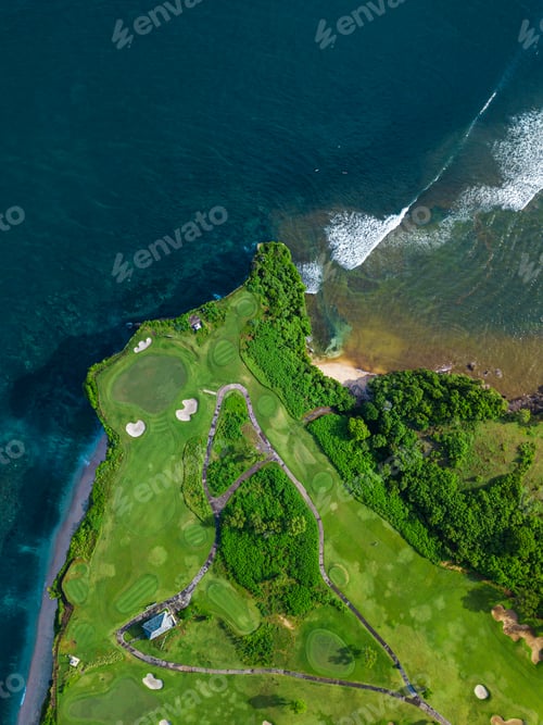 Preview: Aerial view of golf course with green at coast