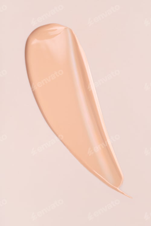 Preview: cosmetic smear foundation cream foundation on a beige background