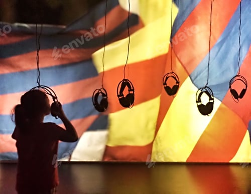 Preview: silhouette of a girl listening to music..