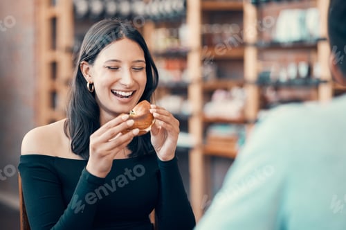 Preview: Happy, beautiful and relaxed woman eating on a date at a restaurant with her partner for the weeken